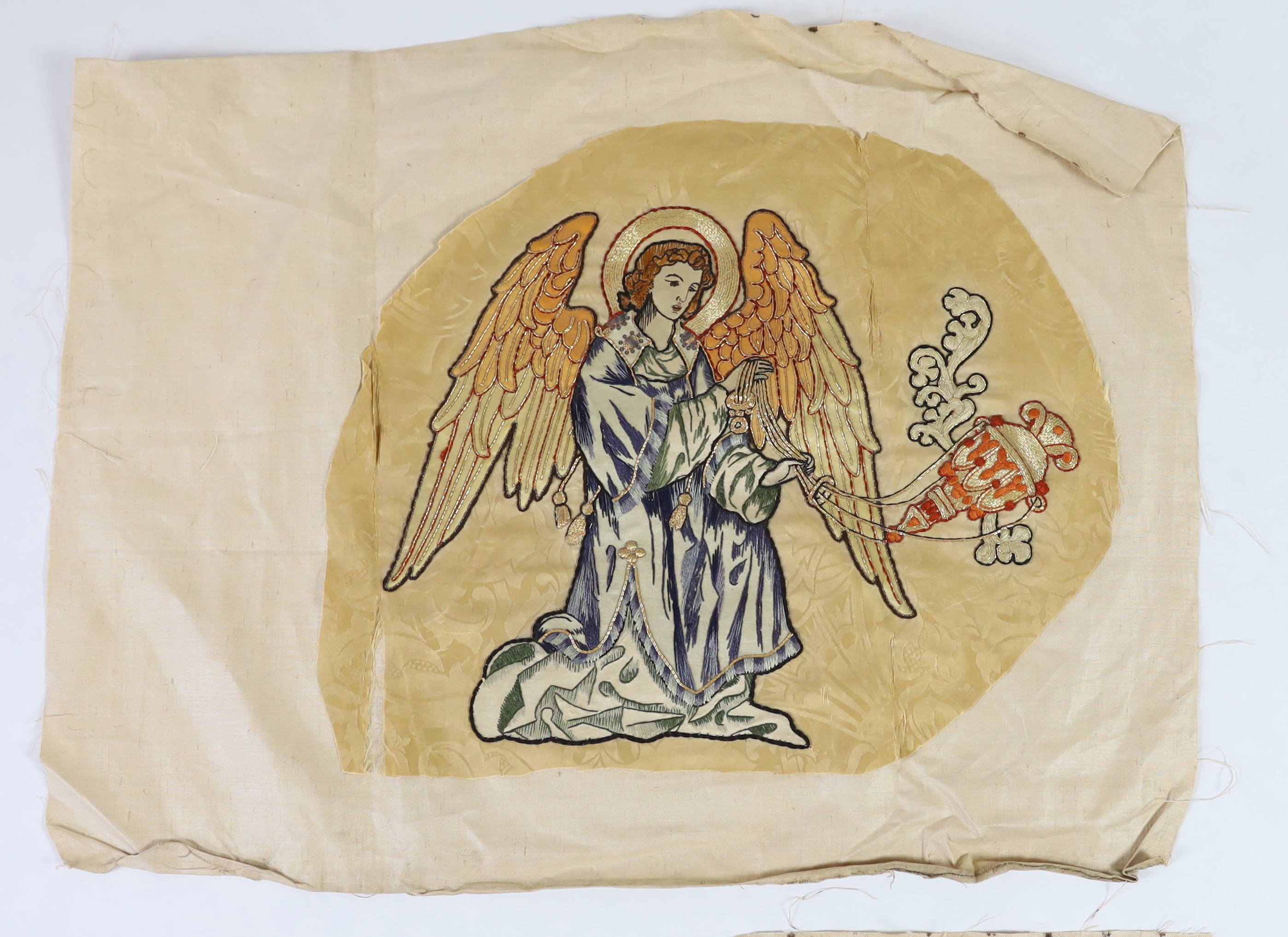 Two 1880-90’s angelic embroideries, appliquéd onto silk damask, originally from an alter frontal, the appliqués being silk embroidered with gold thread highlights of angels with thurible to cleanse with incense, appliqué